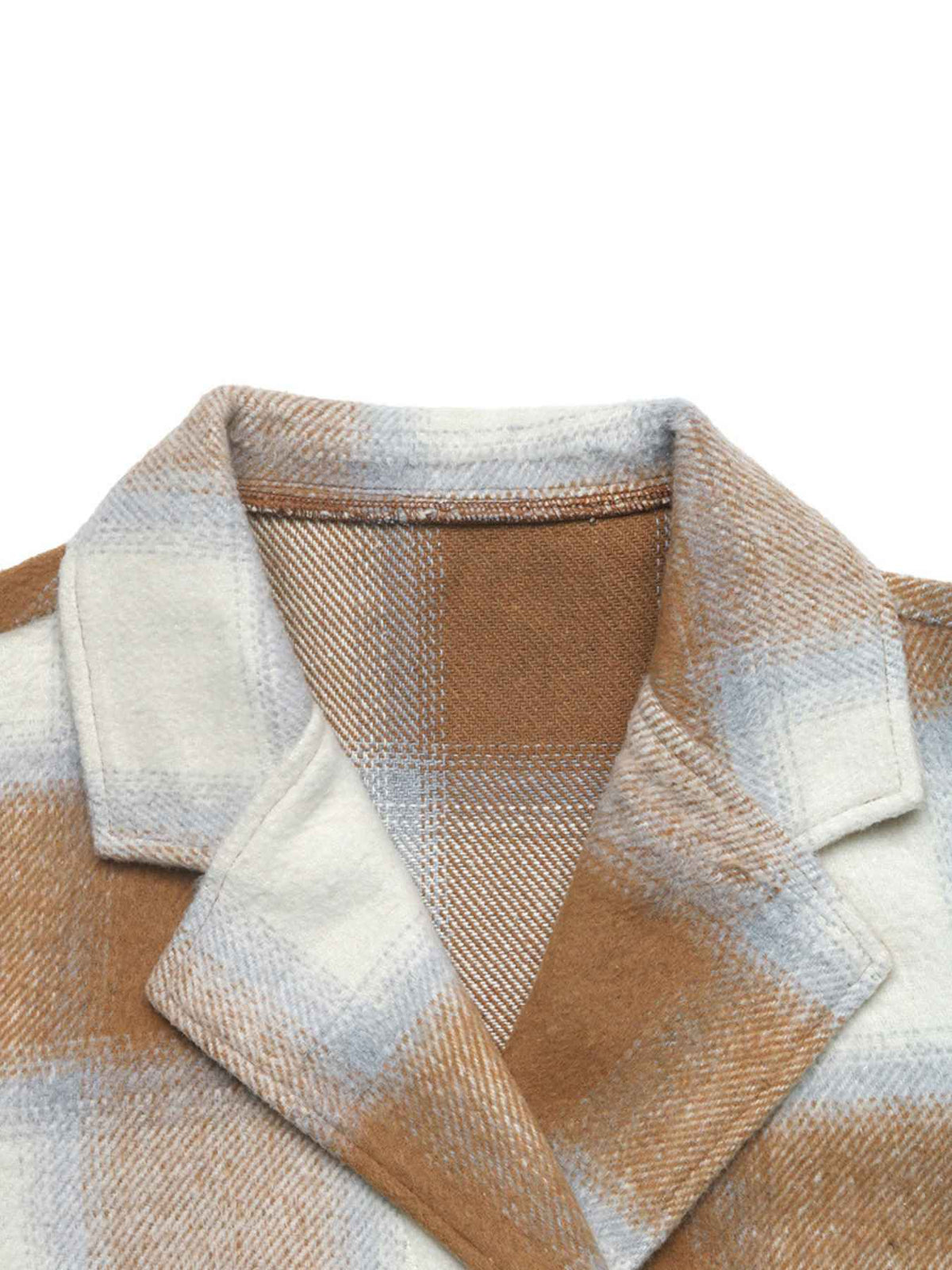 Close-up of a plaid wool-like garment collar in warm brown, cream, and pale blue tones against a plain white background.