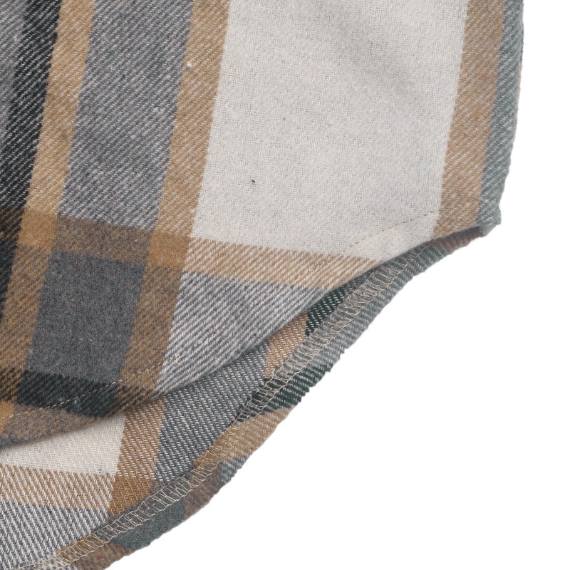 Close-up of a plaid fabric with a mix of gray, beige, brown, and white stripes, showing the texture and fold of the material against a white background.
