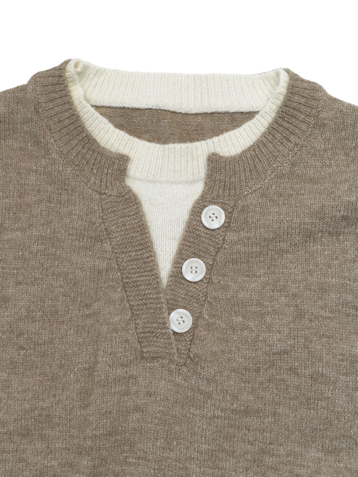 Close-up of a brown knit henley sweater layered over a cream-colored shirt, featuring three white buttons and a ribbed collar.