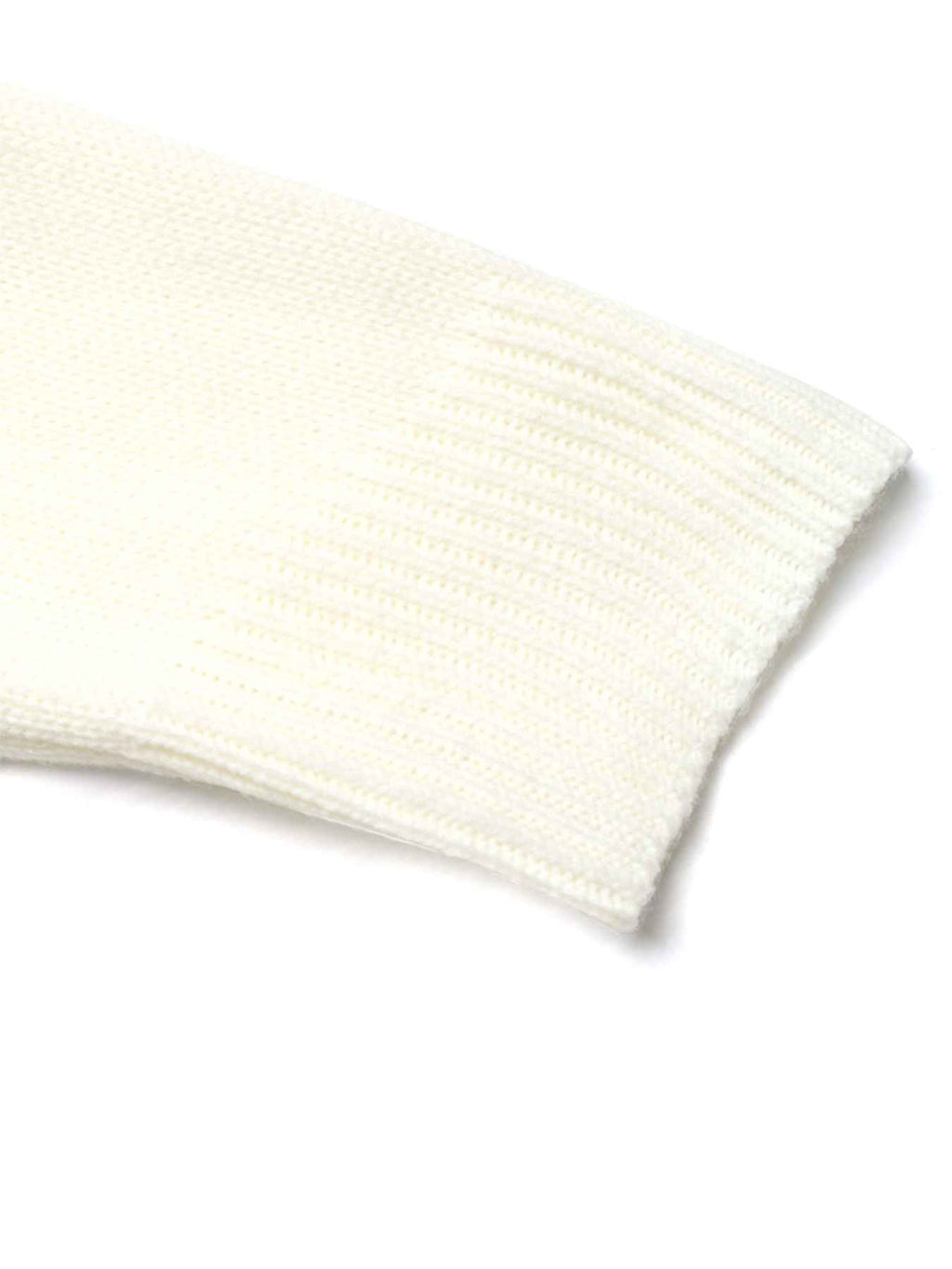 A close-up of a cream-colored ribbed knit fabric, showing the texture and folded cuff edge on a white background.