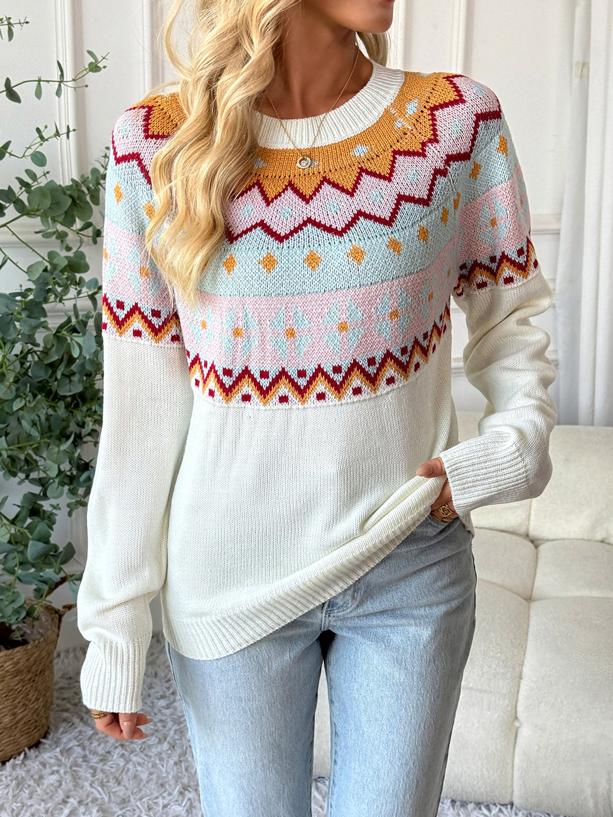 Woman wearing a patterned sweater in a home setting