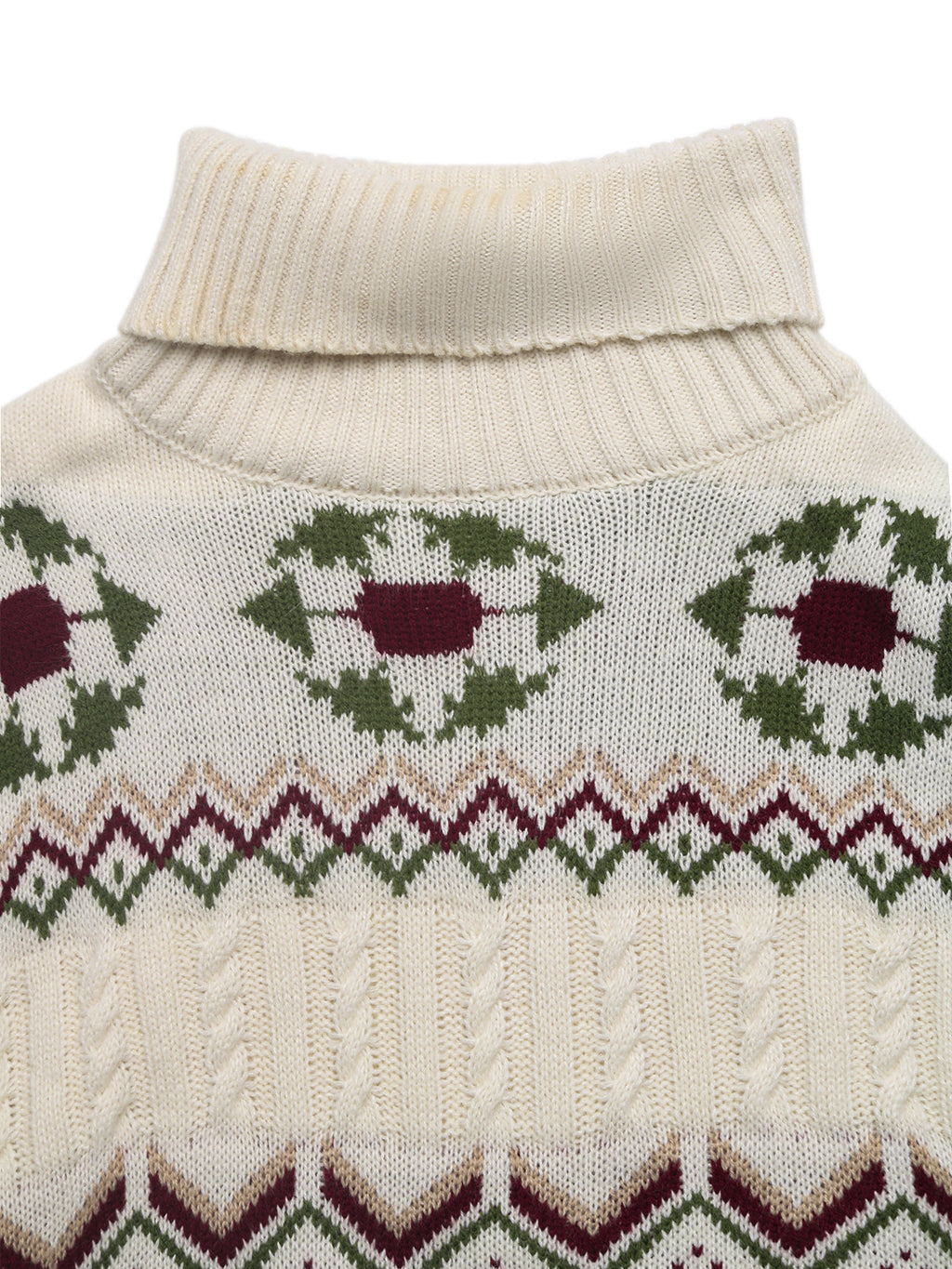 Close-up of a cream-colored sweater with green and red pattern on a white background