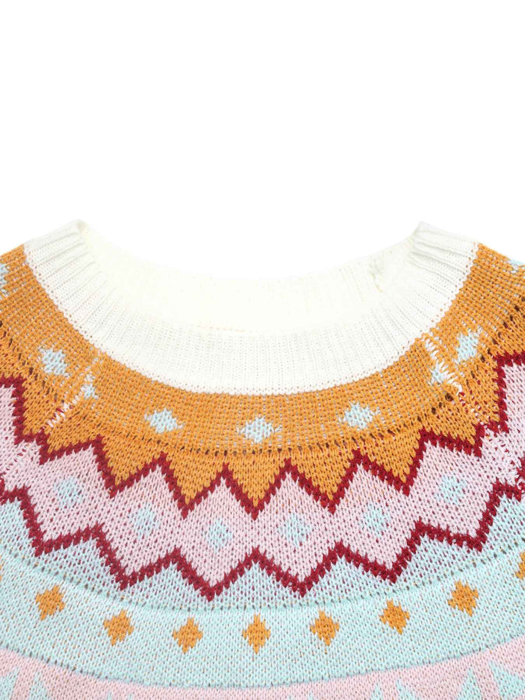 Close-up of a knitted sweater neckline with a multicolor Fair Isle pattern in orange, pink, red, and light blue on a white ribbed collar.
